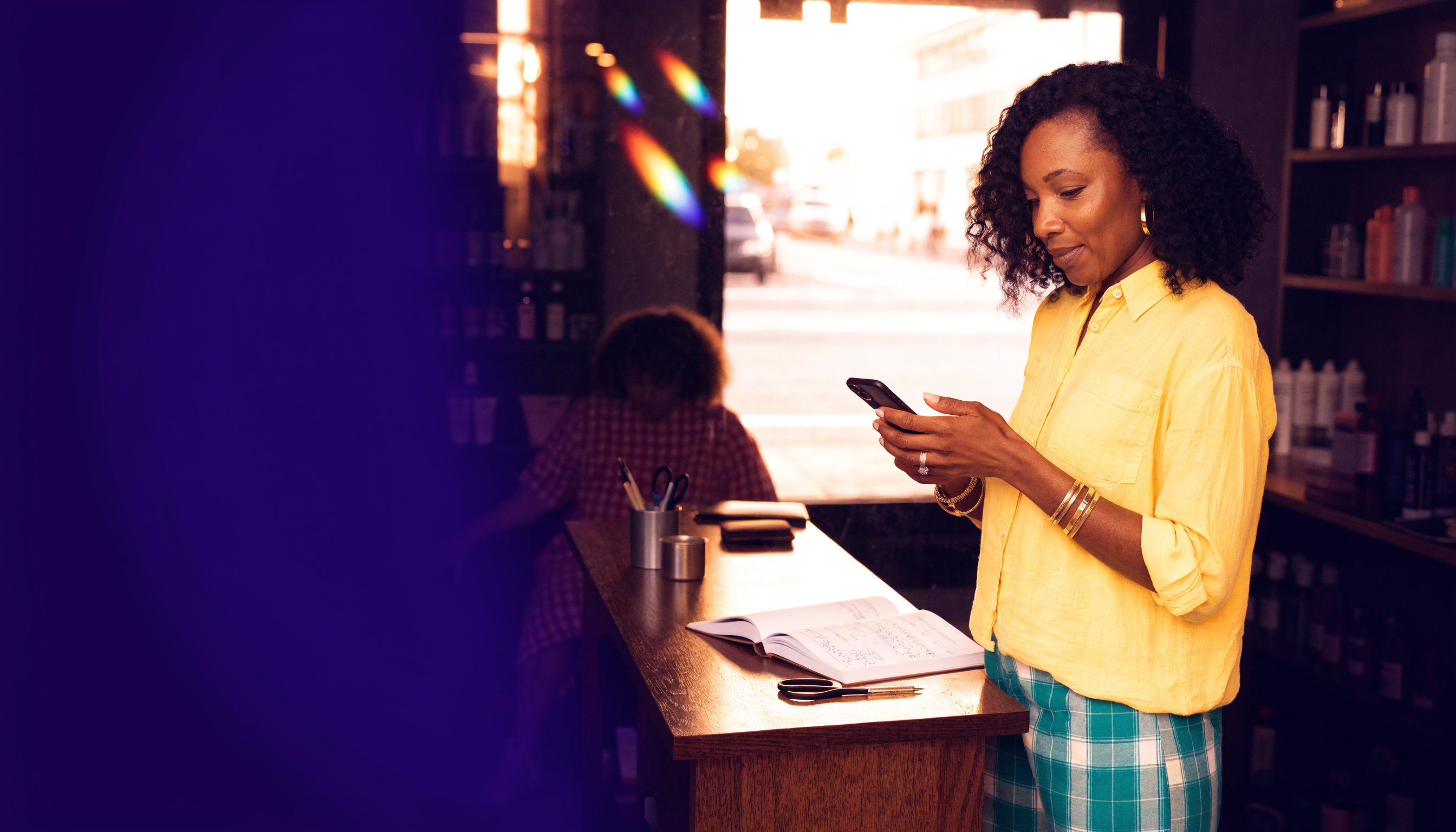A local business owner connecting with a customer from her shop